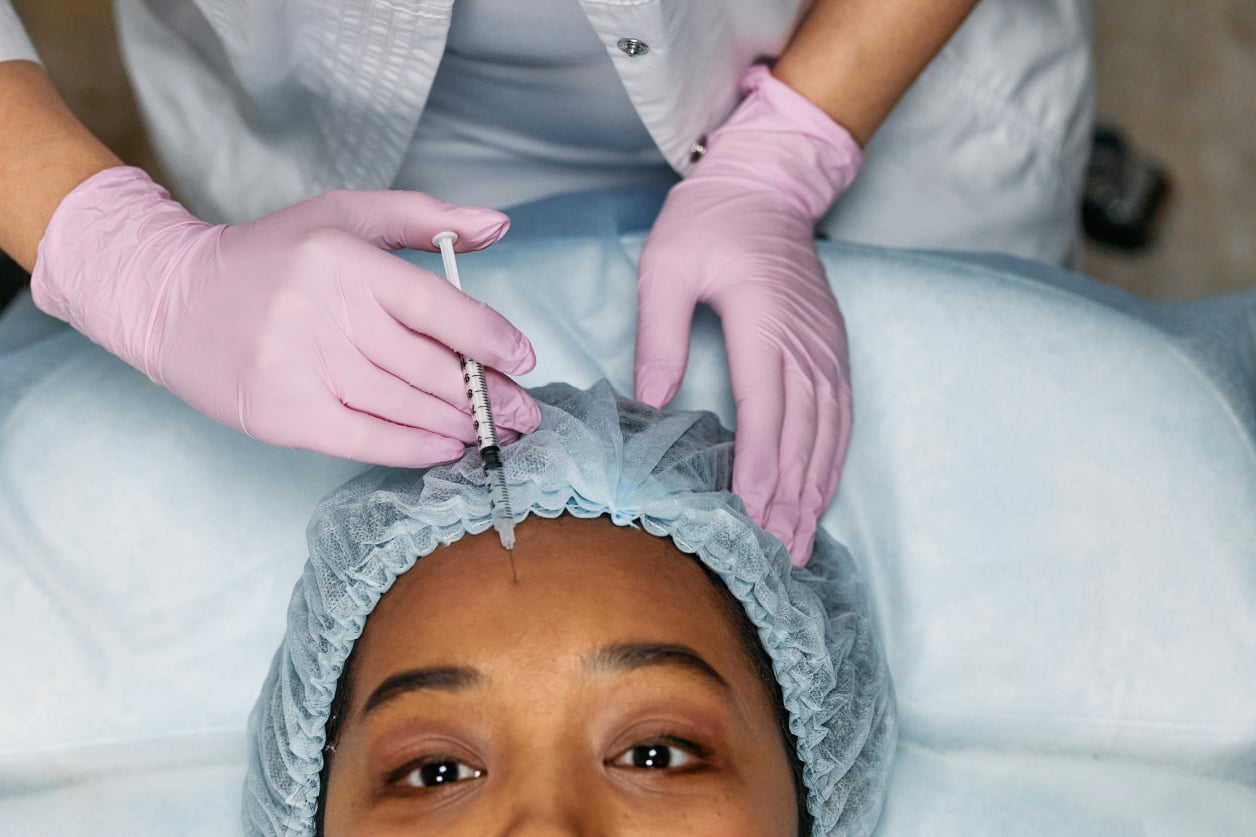 Botox Fri-yay special! A woman gets a botox injection in her forehead